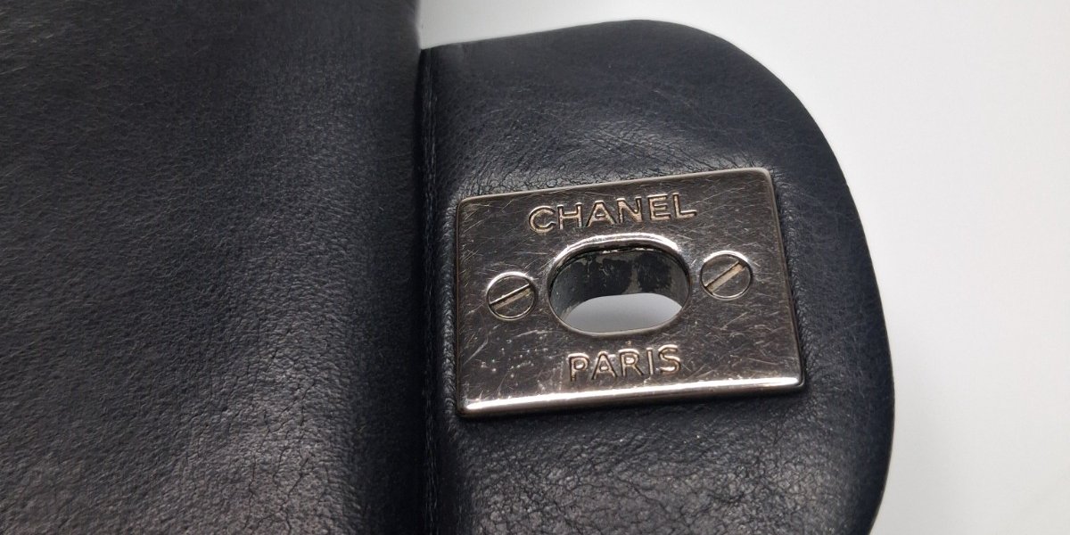 Chanel Paris engraved turn-lock backplate inside a Classic Flap
