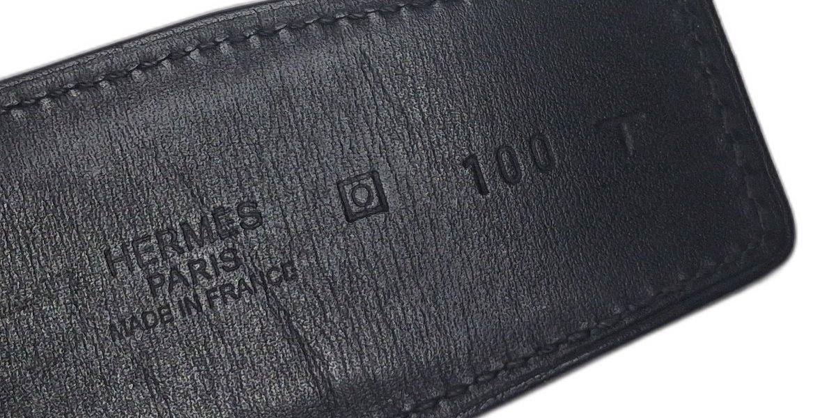 Hermès Paris heat stamp beside a framed year letter