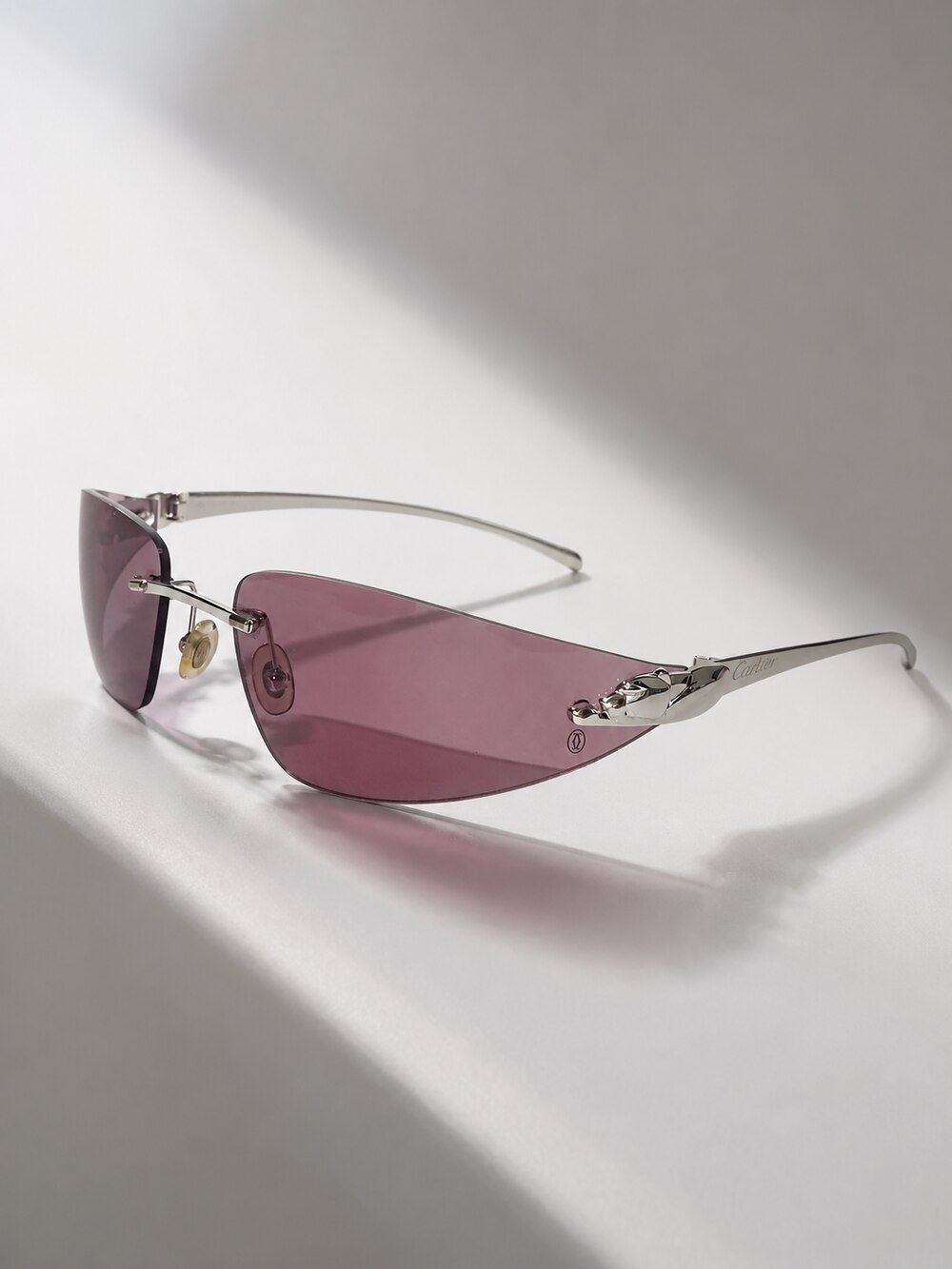 A pair of Cartier Panthère sunglasses in soft studio light